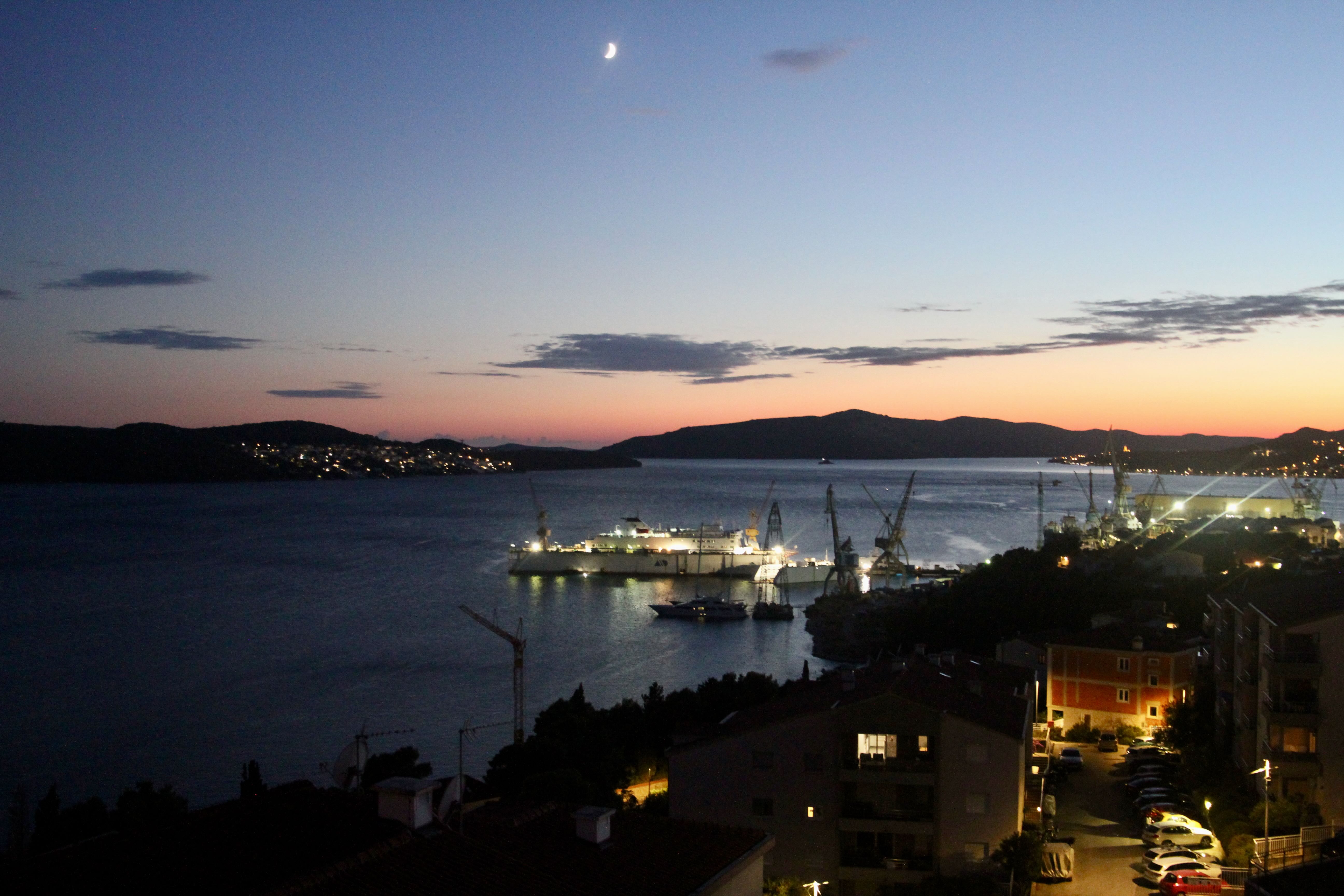 Evening view with moon over the bay – view from balcony