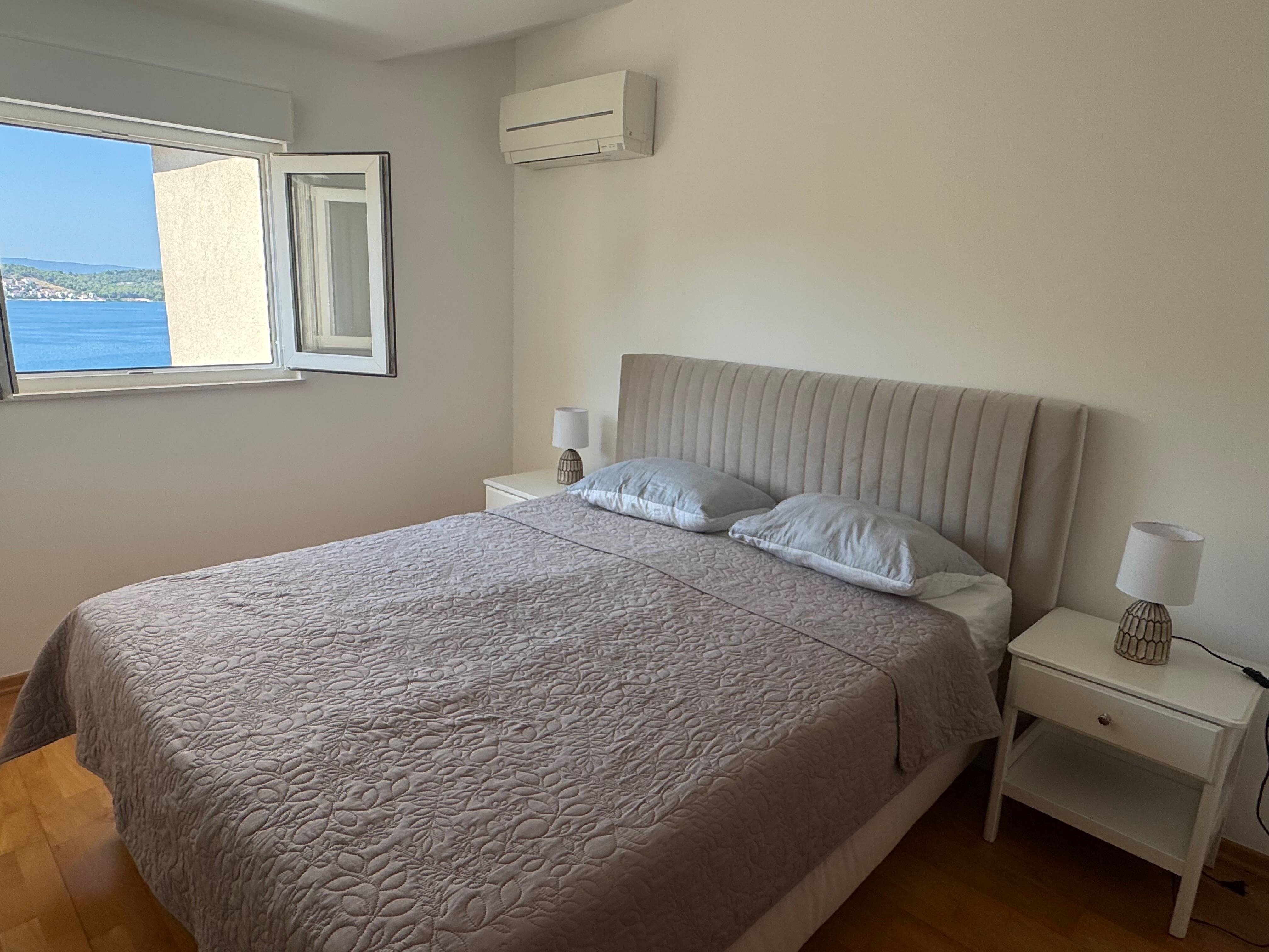 Bedroom with double bed and balcony access